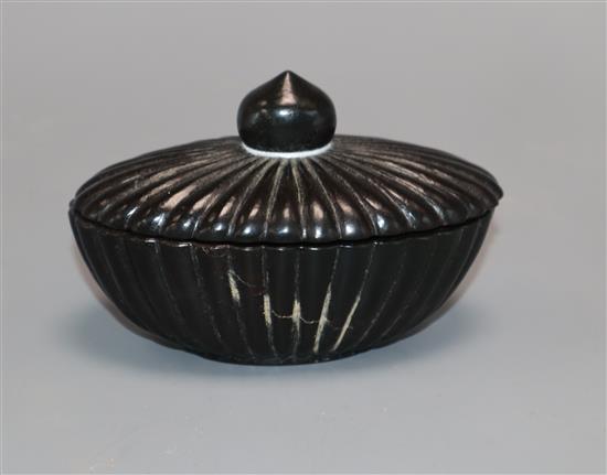 An Indian pot and cover